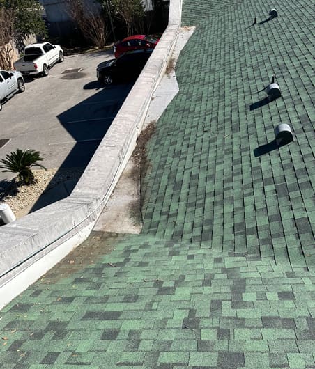 A green roof with a brick pattern on it.
